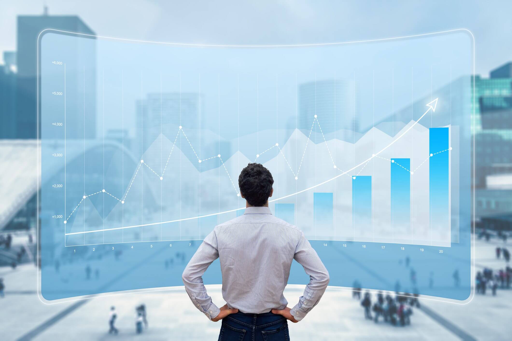 Man looking at rising financial data charts in a cityscape.
