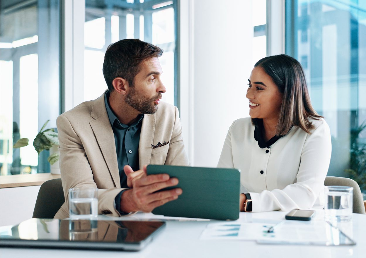 Two colleagues discussing with a tablet.