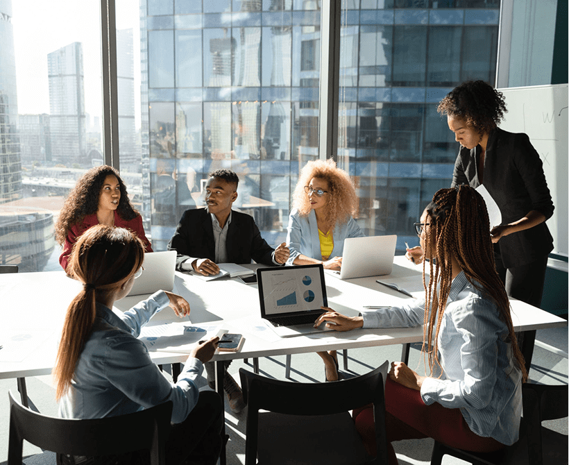 Business meeting with diverse team in office.